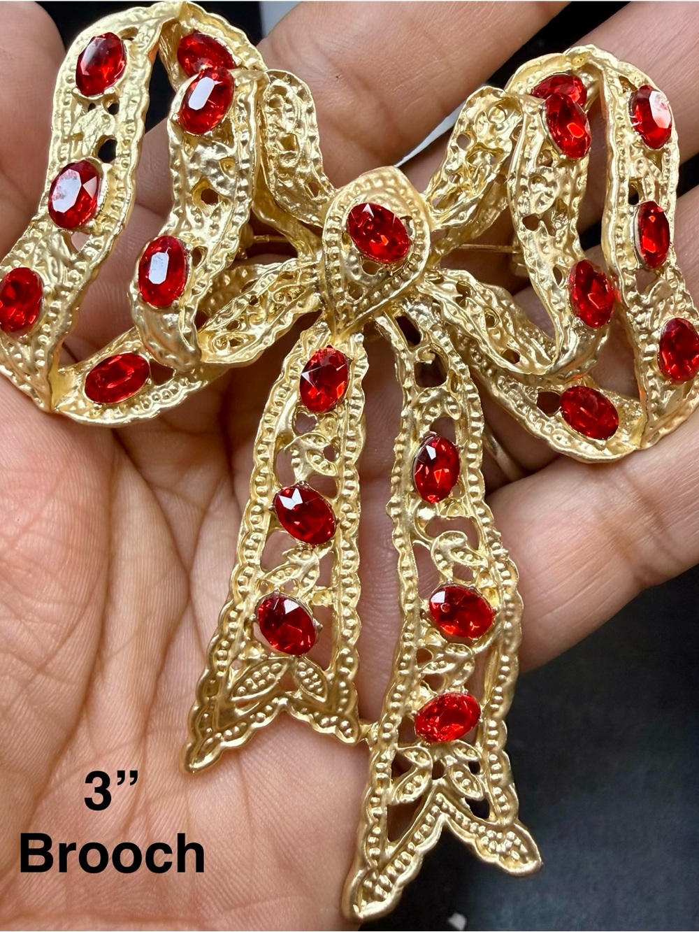 Gold-Tone Bow Brooch with Red Crystals